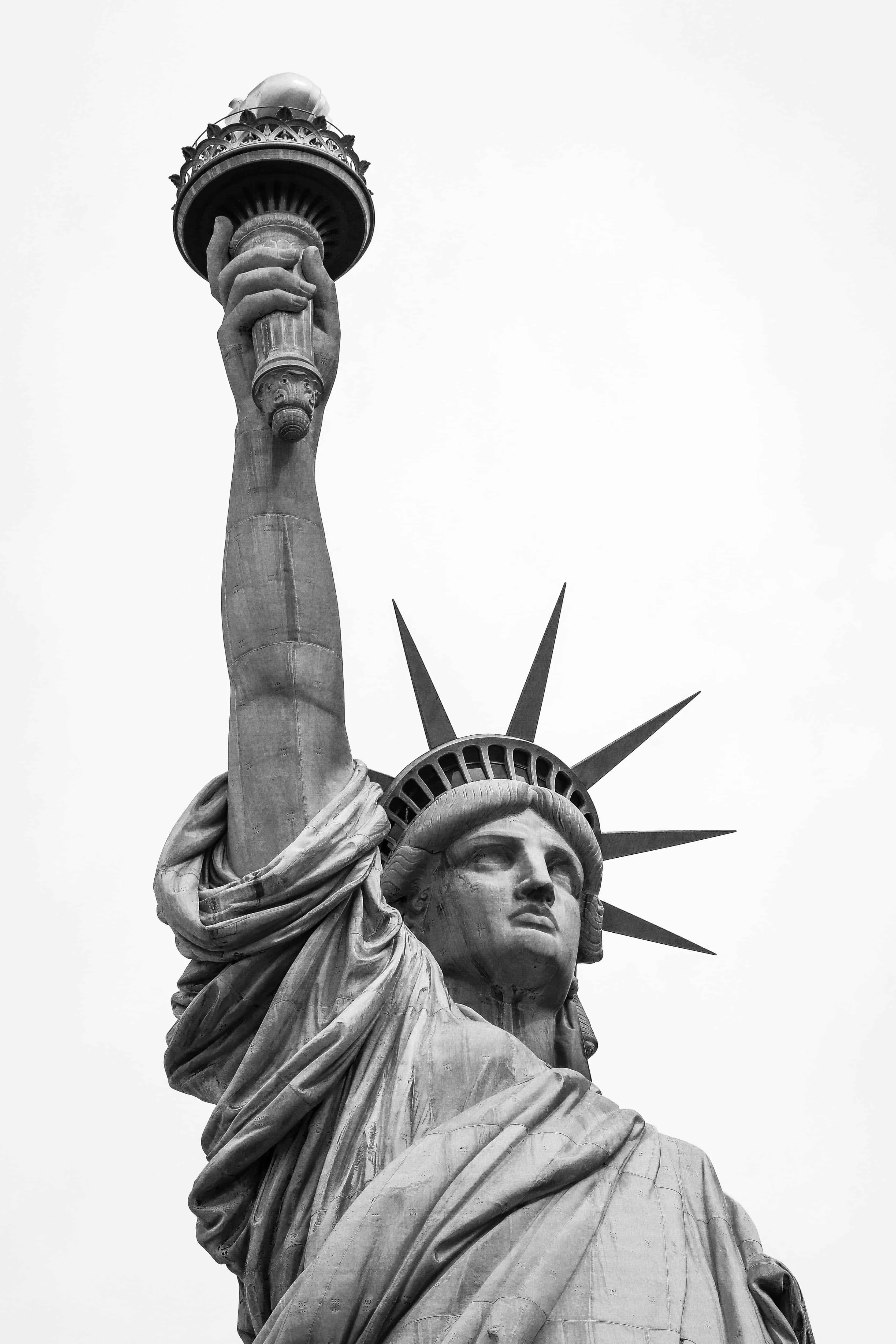 The Statue of Liberty photographed from below in dramatic black and white